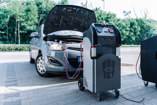Car air conditioning ac repair service. Refill automobile ac compressor and checking auto conditioning system. Auto car conditioner diagnostic.