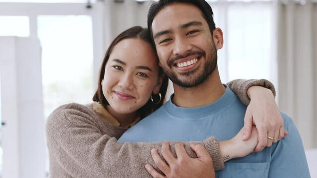 Love, happy couple and a smile in their home, house or bedroom. Romantic, interracial man and woman posing for an intimate photograph together smiling in happiness in their apartment in the morning