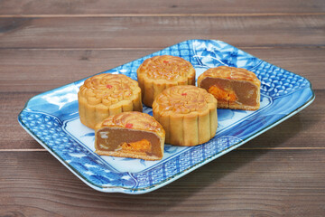 Mooncake for Mid Autumn Festival. Traditional Chinese pastry Moon cake for Chinese Moon festival. Selective focus, copy space