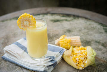 Yellow Sweet corn drink on wood  background , Yellow Corn juice, sweet corn milk, healthy organic...