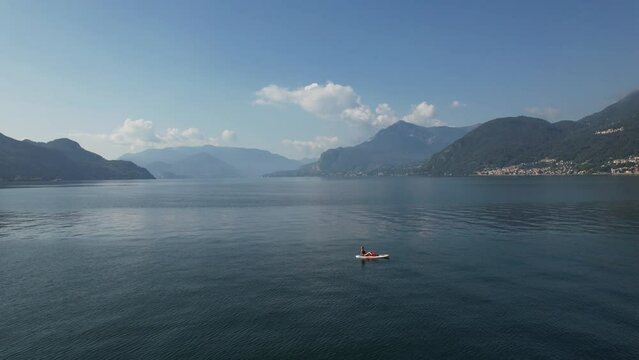 Aerial view of a person doing canoe in the Como Lake, Italy.