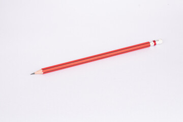 Red pencil on white background