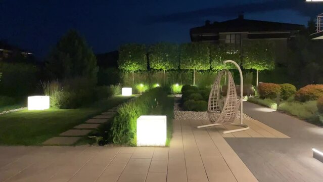 Video of backyard and garden illuminated at night