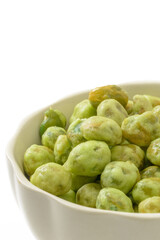 Crispy Green Peas Coated with Wasabi in porcelain cup isolated on white background.