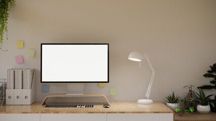 Minimal and cozy office desk workspace with modern pc computer screen mockup