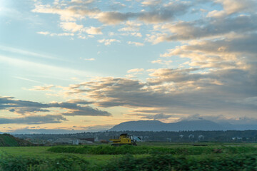 farm land in the city. sunset, moiuntain, clouds