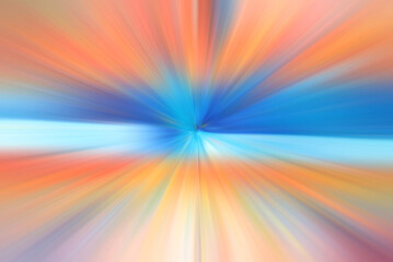 Abstract radial blur zoom in orange, blue and yellow tones.