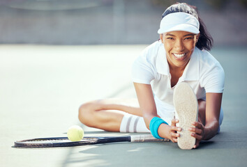 Tennis, exercise and fitness with a sports woman stretching to warmup for a game or match on a...