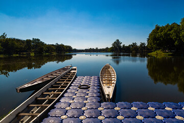 Wooden boats moored on the shore in the midst of beautiful nature.