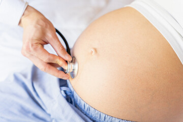Doctor stethoscope patient pregnancy woman. Medical clinic for pregnant consultant. Doctor...