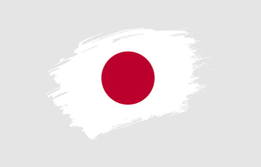 Creative hand drawn grunge brushed flag of Japan with solid background