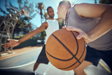 Basketball, competitive sports and practice match with men, players or friends playing a game at an...