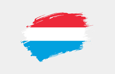 Creative hand drawn grunge brushed flag of Luxembourg with solid background