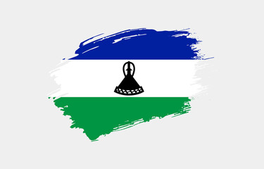 Creative hand drawn grunge brushed flag of Lesotho with solid background