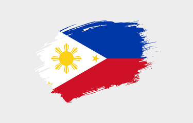 Creative hand drawn grunge brushed flag of Philippines with solid background