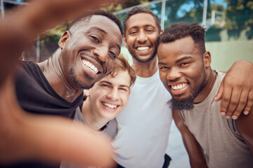 Obraz premium Portrait selfie of basketball men with a smile and happy on a court outdoor after training, exercise or game. Diversity ,cheerful and sport group of fit male athletes together after cardio workout