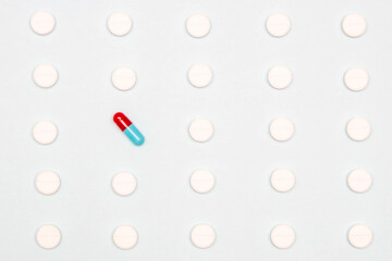 Pharmaceutical and health concept, Tablet and antibiotic capsule arrange in row on white background