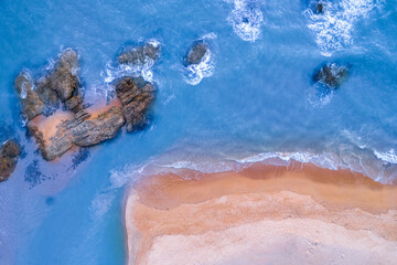 aerial view of sea and ocean waves near the beach Sea water hitting rocks on the beach Looks impressive, the beauty of the sea