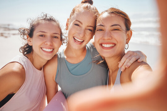 Happy and sport friends selfie at the beach after workout, exercise or training yoga class or pilates. Portrait of smile, fitness or cheerful women bonding, having fun and standing at the ocean