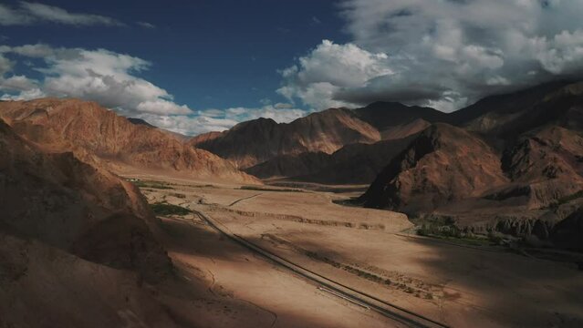 Aerial view of a road crossing a Valley with mountains, Ladakh region, India.