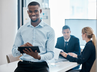 African businessman planning online on tablet, working on corporate marketing strategy and researh for creative ideas for legal company. Face portrait of research lawyer on internet for inspiration