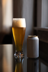 Cold beer on reflective glass table
