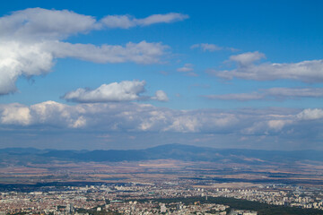 Fototapeta na wymiar Aerial view of the city of Sofia, Bulgaria. The capital of Bulgaria is located in the west of the country at the foot of the Vitosha mountain range. History of city has more than two thousand years.