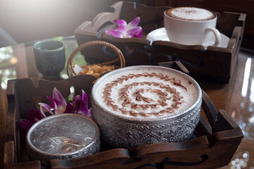 Latte Art Ice coffee in nature background.