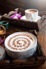 Latte Art Ice coffee in nature background.