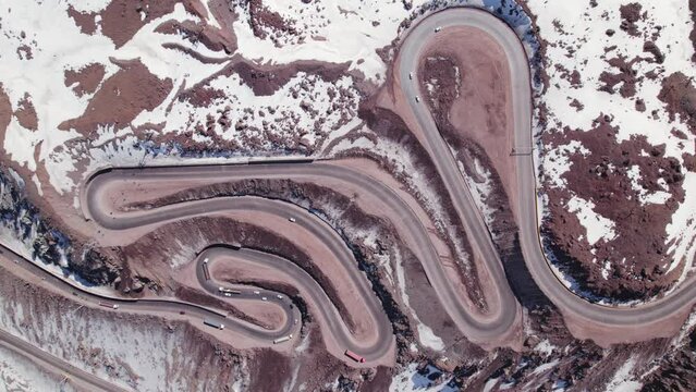 Winding Dangerous Mountain Road - The Paso Internacional Los Libertadores, also called Cristo Redentor or Caracoles in Andes between Argentina and Chile - aerial top down