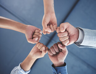 Team success and motivation fist bump of business people with teamwork, work support hand sign. Office group hands together in a circle to show job community, goal collaboration and career target