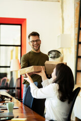 Colleagues in office. Businesswoman and businessman discussing work in office.