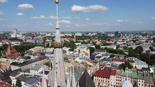 Steeple at St. Mary's Basilica (Bazylika Mariacka) in the City Centre of Krakow, Poland, a Polish cultural capital with renaissance architecture - 4K 30FPS Tracking Up