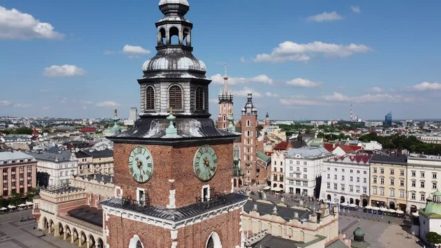 St. Mary's Basilica (Bazylika Mariacka), Clock Tower at the Main Square in Krakow, Poland, a Polish cultural capital, with medieval and renaissance architecture - 4K 30FPS Smooth Tracking Left
