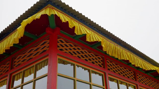 Tengboche Monastery in Nepal detail shot of colourful monastery in the Himalay's of Nepal. Exterior curtains blowing in the wind. Filmed in 60fps optioned to be slowed down.