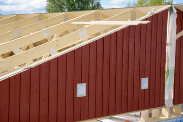 Roof timber frames being built with siding