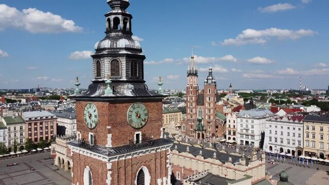 Town Hall Tower (Wieża Ratuszowa) and Cathedral in the main square  - City Centre flyover of Krakow, Poland, a Polish cultural capital, with medieval and renaissance architecture - 4K 30FPS Static
