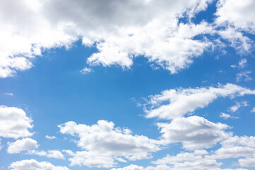 Obraz premium White clouds against the blue sky.