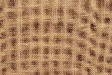 Brown burlap cloth background or sack cloth for packing. Natural linen threads texture. Sackcloth,...