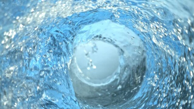 Super Slow Motion Shot of Whirling and Splashing Water in Glass Bottle at 1000fps.