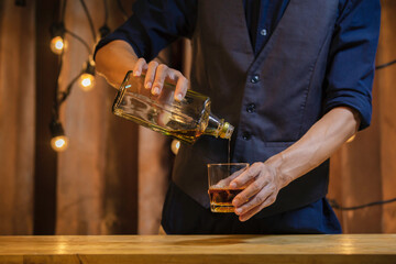 An elegant man suffering from alcoholism drinking whisky	