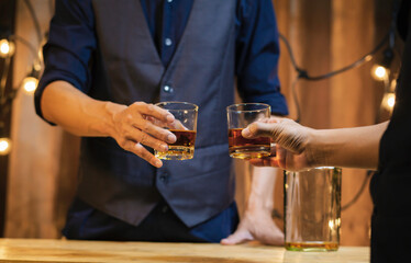 An elegant man suffering from alcoholism drinking whisky	