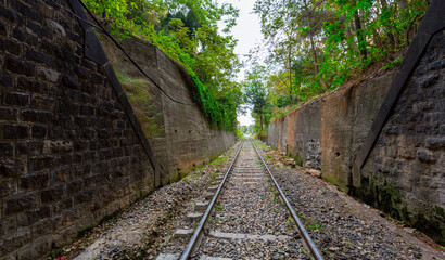 A railroad tunnel with a light at the end. Can represent achieving your goals, getting through...