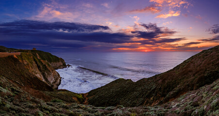 Coastal cliffs by the Devil's Slide trail in California at sunset, long exposure