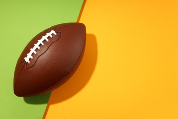 American football ball on two tone background