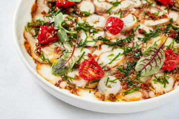 octopus carpaccio with tomato and herb