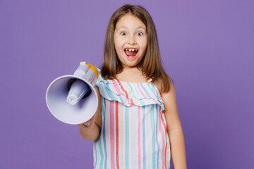 Little kid child girl 5-6 years old wears striped dress hold scream in megaphone announces sale...