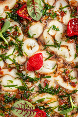 octopus carpaccio with tomato and herb