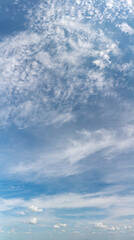 Fantastic clouds against blue sky, panorama