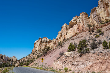Rock formations tower above Burr Trail Road in the Grand Staircase-Escalante National Monument in Utah, USA